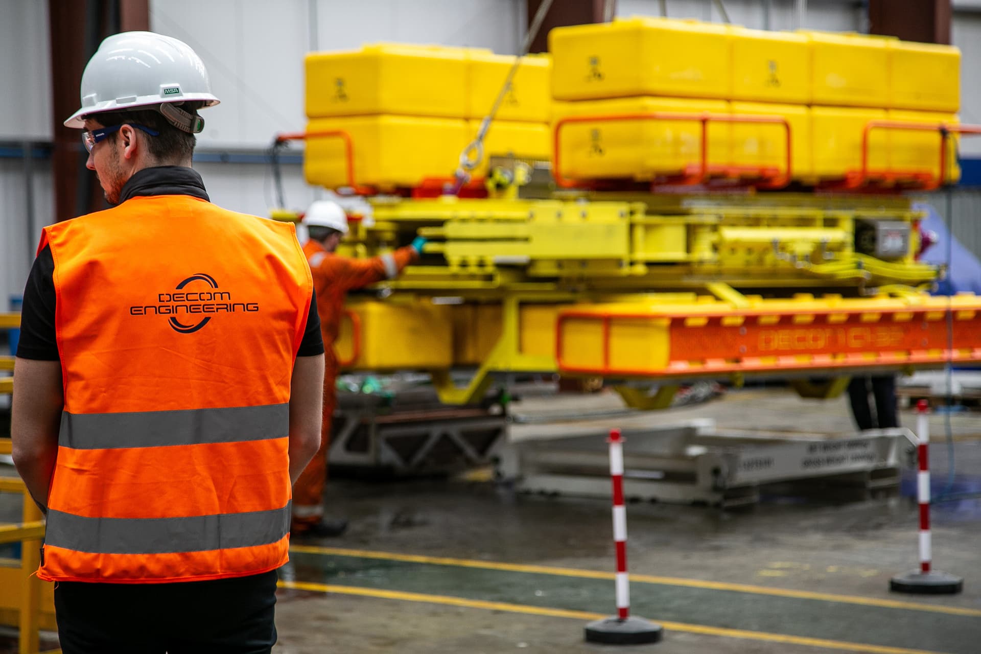 Decom Engineering workshop with engineers working on subsea cutting equipment